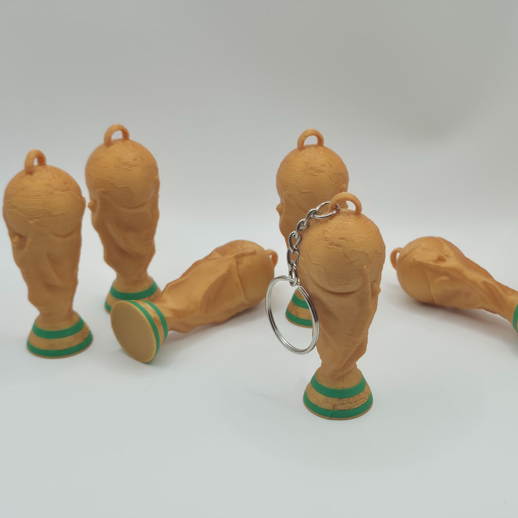 3D printed FIFA World Cup 2026 trophy keychain in gold and green by 3D Nuke Toyz