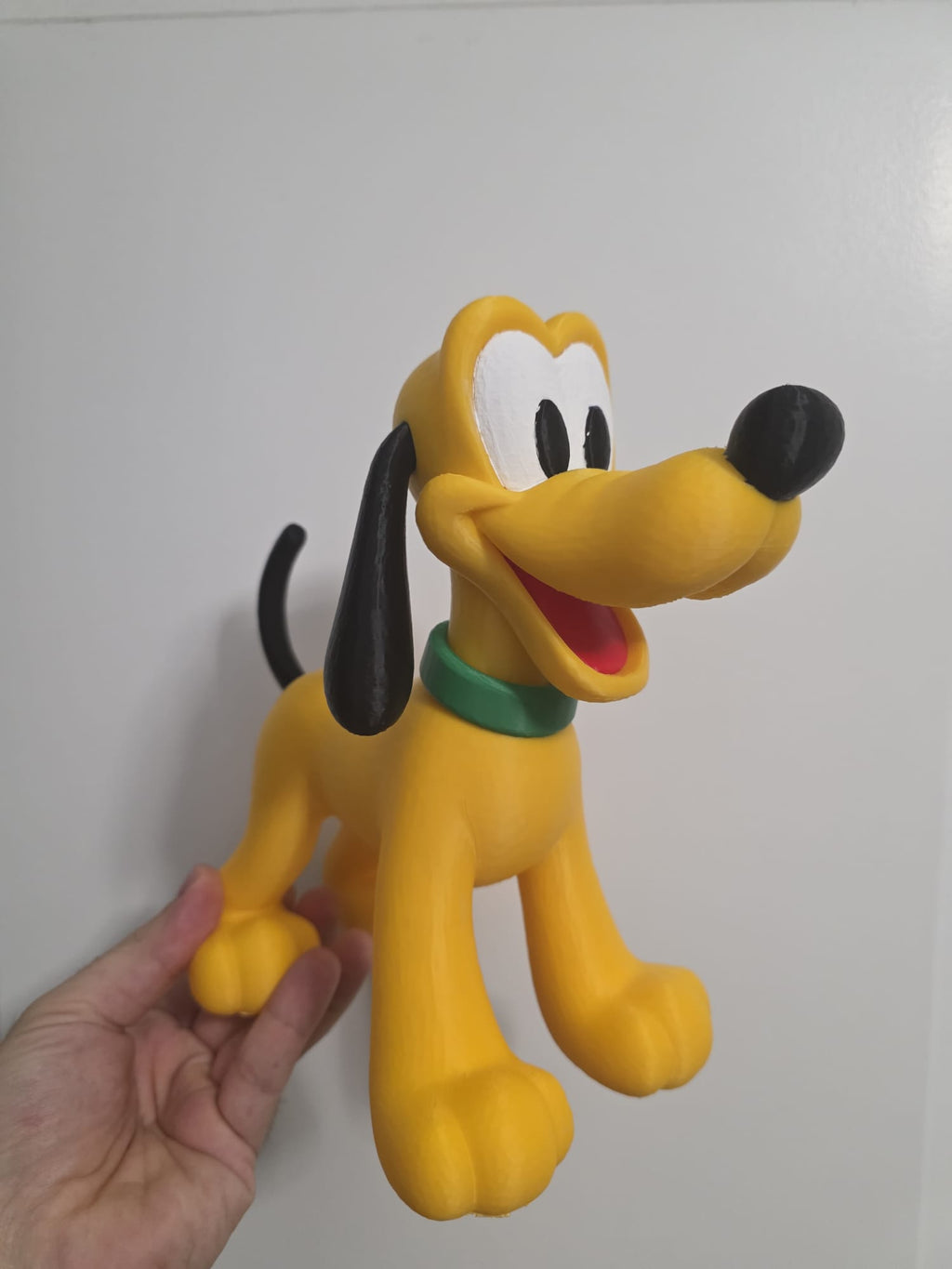 3D printed Pluto figure - side view held in hand